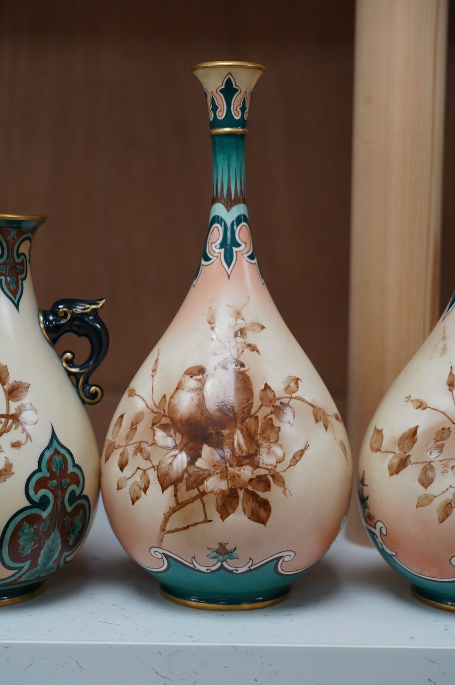 Hadley's Worcester: a pair of vases and two others, tallest 21.5cm. Condition - mostly good, largest vase has two chips to inner upper rim, areas of wear to gilding